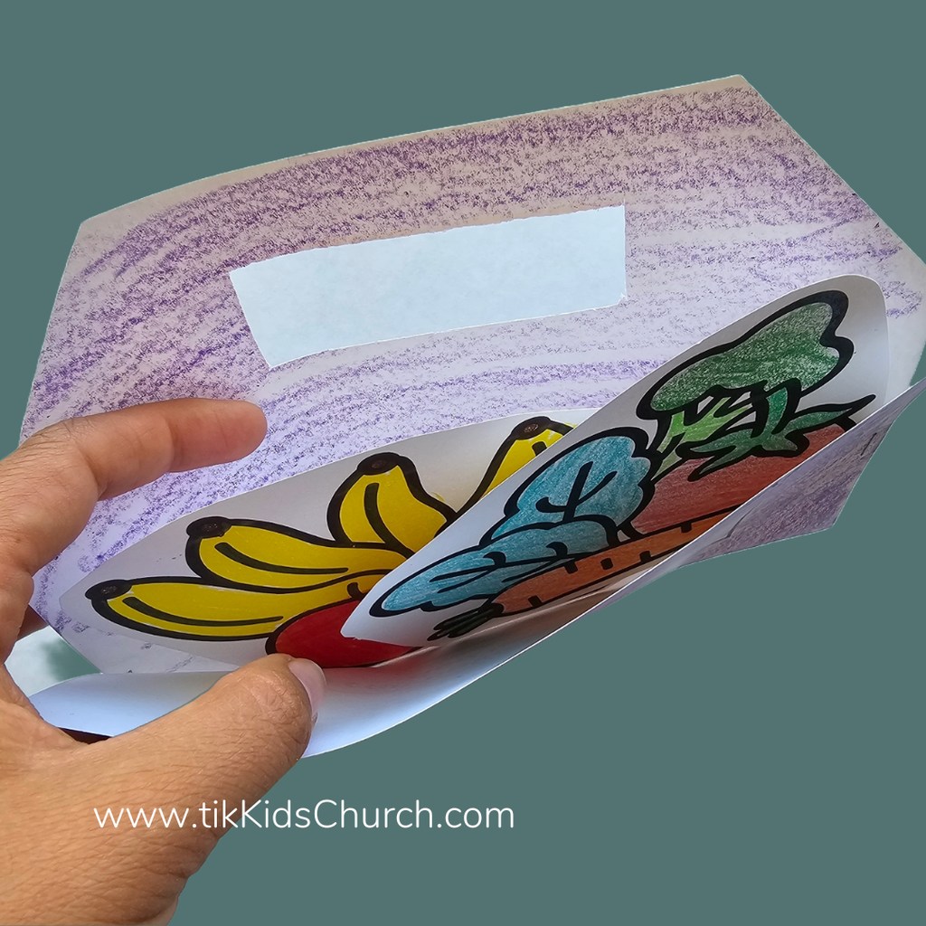 Hand holding a colorful paper craft with leaf designs, branded 'tikKidsChurch.com'.